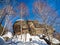 A rock with an Orthodox cross on mountain Church in the winter in Belokurikha, Russia