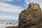 A rock outcrop on a beach