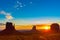 Rock outcrops of Monument Valley silhouetted ar sunset