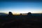 Rock outcrops of Monument Valley silhouetted ar sunset