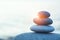 Rock pebble pyramid, zen stones on sea beach