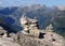 Rock Pile At Dalsnibba Lookout With The Large Mountains Of Geirangerfjord In The Background