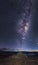 Rock pile pointing at the milkyway during a break hiking at night in Lake Wanaka New Zealand