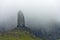 Rock pinnacle The Old Man of Storr in the fog