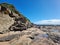 The Rock Platform at Norah Head, at low tide with many rock pools below the cliff