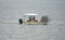 Rock Point, Maryland, U.S- August 15, 2020 - A boat picking up the crab pots on Potomac River