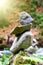 Rock pyramid, rock balancing art. Close-up of a stack of stones in perfect balance in a mountain forest.
