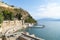 Rock retaining wall and historic fortification with path around coastline at Nafplio