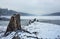 Rock at a river in a silent cloudy winter country