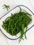 Rock samphire on a white table