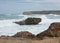 A rock in the sea in the distance on the Great Ocean Road in Australia