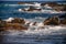 Rock and sea. View of turuoise water and lava rocks beach, atlantic ocean waves. Topical travelling background. Tenerife