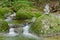 Rock stack, next to a wild stream, a pile of stacked rocks