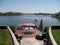 Rock Staircase Leading to Redwood Patio and Pontoon Boat