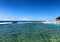 Rock swimming pool flowing into the Pacific Ocean