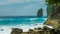 Rock in Tembeling Coastline at Nusa Penida island, Ocean Waves in Front. Bali Indonesia