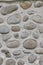 Rock wall of natural river stones. Round stones wall background. River round Stones pattern. Stones texture. River rocks backgroun