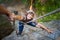 Rockclimber helping to female climber to reach top of mountain