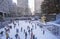 Rockefeller Square with snowy ice skating rink and Christmas tree in mid-town Manhattan, NY