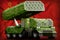 Rocket artillery, missile launcher with pixel green camouflage on the Soviet Union SSSR, USSR national flag background. 9 May, V