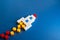Rocket from blocks on takeoff. Concept of a successful start of a business project. Investments in the development of high-tech