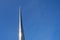 The rocket is soaring up on the blue sky background. Memorial Museum of cosmonautics of the USSR in Moscow, copy space for text