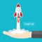 Rocket start up launch from businessman hand flat vector