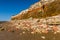 The rockfall at Old Hunstanton beach reflects the triple layers found in the white, red and orange stratified cliffs, Norfolk, UK