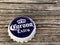 Rockford,WI/USA.- Feb 12, 2019: Cap of Corona Extra beer close up on wooden table. Corona is the most popular imported beer in the