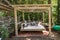 Rocking bed pergola. Garden bed with pillows