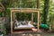 Rocking bed pergola. Garden bed with pillows