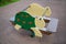 Rocking chair on a metal spring in the form of a green wooden turtle on a clear sunny day. Playgrounds, sports