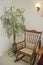 Rocking chair and plant in a house