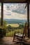 rocking chair on a porch overlooking a peaceful landscape