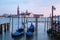 Rocking the Venetian gondolas against San Giorgio Maggiore Church on the Grand Canal