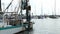 ROCKPORT, TX - 3 FEB 2020: Closeup clip of a commercial shrimp boat trawler at dock in marina, with rigging nets waving in the