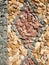 Rocks arranged as mosaic on a wall