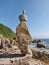 Rocks balanced by ocean