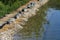 Rocks on bank of natural swimming pond or pool NSP