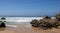 Rocks on a beach with blue sky