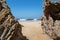 Rocks on a beach with blue sky