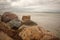 Rocks on beach at sunset