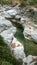 Rocks below a waterfall in Greece