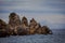 Rocks of bizarre shapes in Paleokastritsa bay on a rainy day