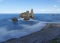 Rocks in the blue waters of the cantabric sea, pendueles beach in Asturias.