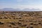 Rocks in a bog with Twelve Bens mountains in background