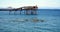 Rocks, bridge and green sea background, landscape