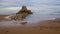 Rocks caressed by the sea on the beach