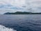 Rocks cliff mast green tress rain forest island ocean sea water blue ferry boat transport gulf thailand koh samui tao