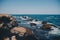 Rocks and cliffs on the beach in Playa de los Muertos, Spain